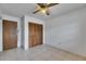 Bedroom featuring a closet, ceiling fan, and tiled flooring at 1309 Sandalwood Dr, Plant City, FL 33563