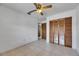 Bedroom featuring a closet, ceiling fan, and tiled flooring at 1309 Sandalwood Dr, Plant City, FL 33563