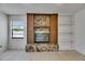 Decorative fireplace with custom stone and wood mantle at 1309 Sandalwood Dr, Plant City, FL 33563