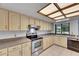 Kitchen featuring stainless steel appliances, neutral countertops and views of the backyard at 1309 Sandalwood Dr, Plant City, FL 33563