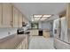 Bright kitchen featuring stainless steel appliances and neutral cabinets at 1309 Sandalwood Dr, Plant City, FL 33563