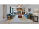 Spacious living room with two sofas, fireplace and built-in shelving at 1309 Sandalwood Dr, Plant City, FL 33563