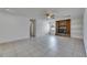 Spacious living room with tile floors and decorative fireplace at 1309 Sandalwood Dr, Plant City, FL 33563