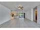 Open-concept living room connecting to kitchen and outdoor patio at 1309 Sandalwood Dr, Plant City, FL 33563