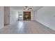 Bright living room featuring stone fireplace and built-in shelving at 1309 Sandalwood Dr, Plant City, FL 33563