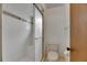 The shower has white tiles, a glass door, and next to it is a toilet at 1309 Sandalwood Dr, Plant City, FL 33563