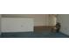This room features carpeting and white walls with minimal decor at 13627 San Rafael Dr, Largo, FL 33774