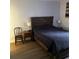 Comfortable bedroom with a large bed and bedside lamps at 14219 Shadow Moss Ln # 102, Tampa, FL 33613
