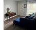 Inviting living room with hardwood floors and a comfortable blue sofa at 14219 Shadow Moss Ln # 102, Tampa, FL 33613