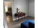Relaxing living room featuring a sofa and adjacent bedroom at 14219 Shadow Moss Ln # 102, Tampa, FL 33613