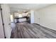 Beautiful gray wood-look floors throughout the open living and kitchen space in a renovated home at 1557 S Martin Luther King Jr Ave, Clearwater, FL 33756