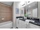 Well-appointed bathroom with granite countertops and a shower-tub combo at 1561 S Martin Luther King Jr Ave, Clearwater, FL 33756
