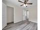 Bright bedroom featuring gray floors and access to closets and other rooms at 1561 S Martin Luther King Jr Ave, Clearwater, FL 33756