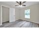 The light and airy bedroom has a closet, a window, and light gray flooring at 1561 S Martin Luther King Jr Ave, Clearwater, FL 33756