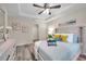 Bright and airy bedroom highlighting the tray ceiling, modern ceiling fan, and natural light at 1561 S Martin Luther King Jr Ave, Clearwater, FL 33756