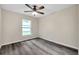 The bedroom is very bright and spacious, featuring new gray wood-look flooring at 1561 S Martin Luther King Jr Ave, Clearwater, FL 33756