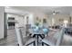 Open-concept dining area connecting the kitchen and living room with a modern table at 1561 S Martin Luther King Jr Ave, Clearwater, FL 33756