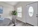 Bright entryway featuring a stylish front door with decorative glass and modern flooring at 1561 S Martin Luther King Jr Ave, Clearwater, FL 33756