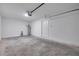 Empty two-car garage featuring modern garage door opener and painted walls at 1561 S Martin Luther King Jr Ave, Clearwater, FL 33756
