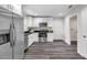 Contemporary kitchen featuring stainless steel appliances, granite countertops, and white cabinets at 1561 S Martin Luther King Jr Ave, Clearwater, FL 33756