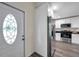 Inviting kitchen featuring stainless steel appliances and sleek white cabinetry at 1561 S Martin Luther King Jr Ave, Clearwater, FL 33756