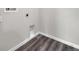 Compact laundry area featuring modern gray floors and standard hookups at 1561 S Martin Luther King Jr Ave, Clearwater, FL 33756