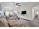 Open living space with dining area and new gray wood-look flooring, ceiling fan, and neutral decor at 1561 S Martin Luther King Jr Ave, Clearwater, FL 33756