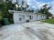 View of the home's backyard featuring a patio and access doors at 1619 E Nome St, Tampa, FL 33604