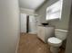 Cozy bathroom featuring a walk-in shower, vanity, and tiled flooring at 1619 E Nome St, Tampa, FL 33604