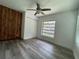 Cozy bedroom featuring a window, closet, and vinyl floor at 1619 E Nome St, Tampa, FL 33604