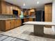 Spacious kitchen boasts ample cabinet space, modern appliances, and a convenient center island at 1619 E Nome St, Tampa, FL 33604