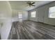 Spacious living room with new flooring and ample natural light at 1619 E Nome St, Tampa, FL 33604