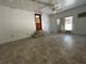 Open living area with tile floors, ceiling fans, and backyard access at 1619 E Nome St, Tampa, FL 33604