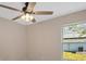 Bedroom with a ceiling fan and a window bringing in natural light and fresh air at 163 Swift St, Port Charlotte, FL 33954