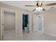 Bedroom with white floors leading to doors revealing bathroom and hallways, enhancing space at 163 Swift St, Port Charlotte, FL 33954