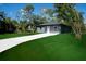 Single-story home with well-manicured lawn and long driveway at 163 Swift St, Port Charlotte, FL 33954