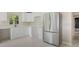 Kitchen features stainless steel refrigerator, modern appliances, and ample counter space at 163 Swift St, Port Charlotte, FL 33954