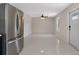 Open concept living room featuring modern stainless steel refrigerator and plenty of space at 163 Swift St, Port Charlotte, FL 33954