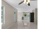 Open concept living room with plenty of natural light and a modern ceiling fan at 163 Swift St, Port Charlotte, FL 33954