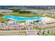 Aerial view of the lagoon showing the various amenities and recreational spaces available in the community at 17415 Holly Well Ave, Wimauma, FL 33598