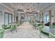 Clubhouse interior with modern lighting fixtures, multiple tables, and comfortable seating at 17415 Holly Well Ave, Wimauma, FL 33598