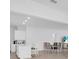 Bright and airy dining area and kitchen featuring a large island with seating at 17415 Holly Well Ave, Wimauma, FL 33598