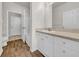 Bathroom featuring modern vanity, countertop, hardwood floors, and a shower tub at 18001 Richmond Place Dr # 116, Tampa, FL 33647