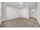 Bright bedroom with ceiling fan and access to the bathroom at 18001 Richmond Place Dr # 116, Tampa, FL 33647