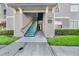 Apartment building entrance with green stairwell and unit number sign at 18001 Richmond Place Dr # 116, Tampa, FL 33647