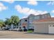 Attractive three-story apartment building with ample parking and tiled roof detail at 18001 Richmond Place Dr # 116, Tampa, FL 33647