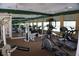 Well-equipped fitness center with treadmills, weights, and mirrored walls at 18001 Richmond Place Dr # 116, Tampa, FL 33647