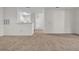 Open floor plan featuring neutral paint and carpet throughout at 18001 Richmond Place Dr # 116, Tampa, FL 33647