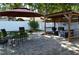 Outdoor patio featuring paved surface, seating area, umbrella, and a built-in outdoor kitchen at 3212 Stevenson St, Plant City, FL 33566