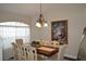 Elegant dining room featuring a large table, ornate chairs, and natural light at 3212 Stevenson St, Plant City, FL 33566